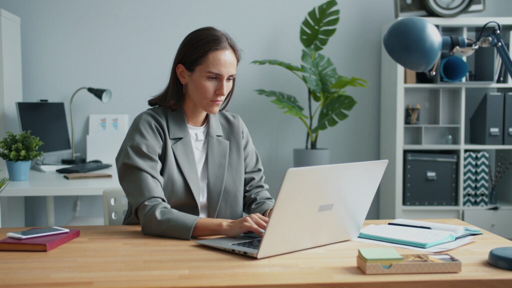 Professional woman working on a laptop