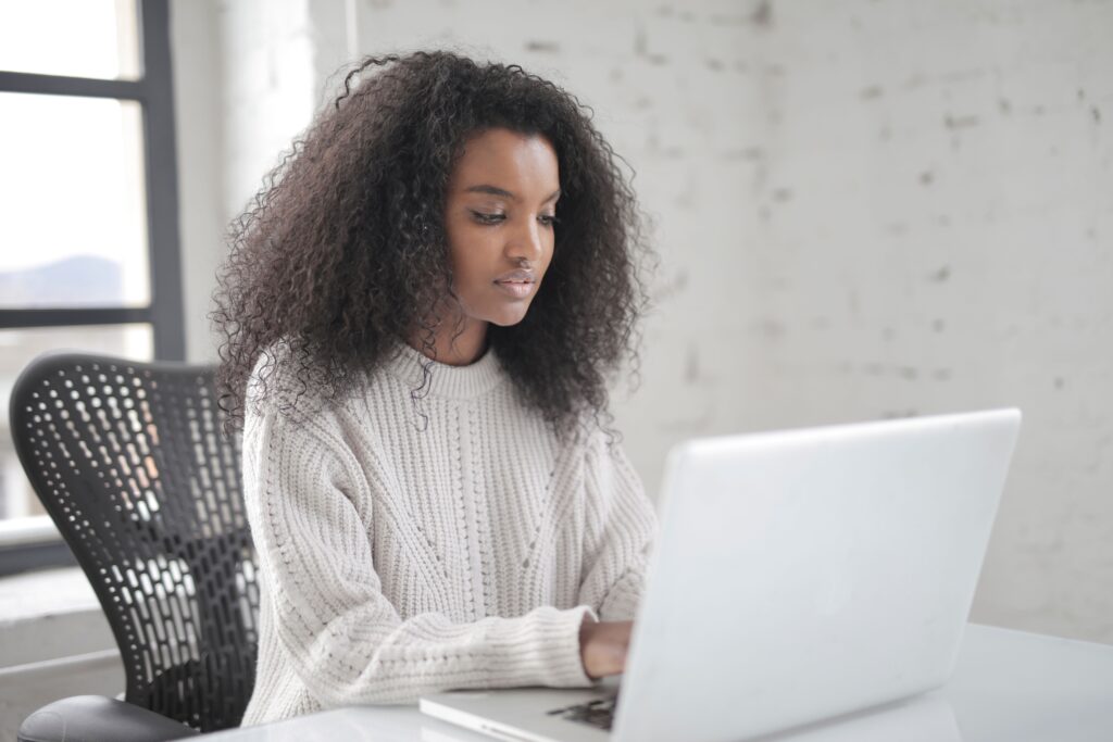 Woman checking bank account securely on a laptop