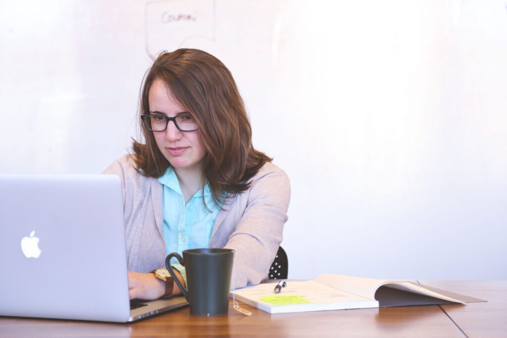 Woman managing passwords safely on a laptop